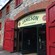 Modern glass doors at the entrance of the historic building for Jameson Irish Whiskey